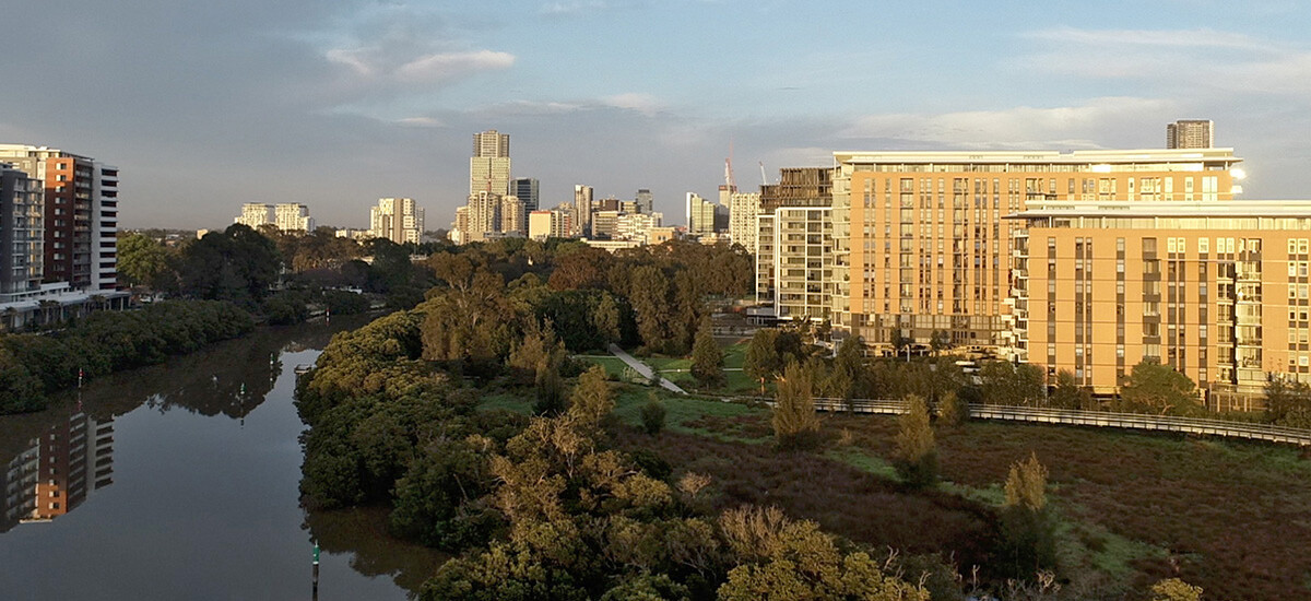 Looking west from above the Parramatta River, this is a sunrise view of the Parramatta city skyline. This rapidly expanding area needs building designers and architectural plans!